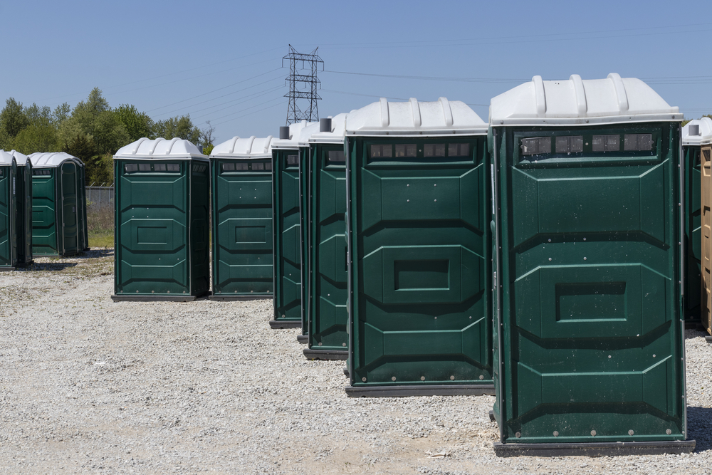 standard portable toilets lined up in Hesperia